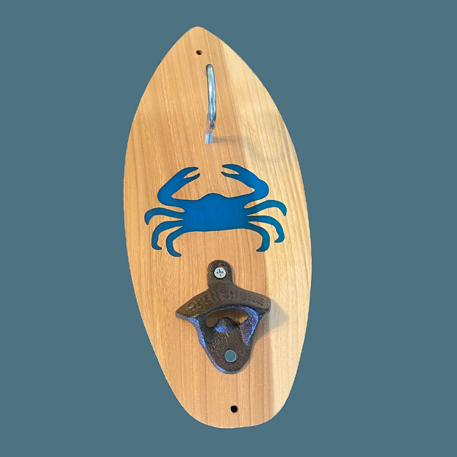 Wooden surfboard shaped tiki toss ring game featuring custom design and bottle opener